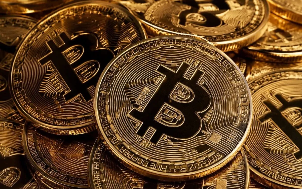 Bitcoin wallet icon and an AI chatbot on a computer screen